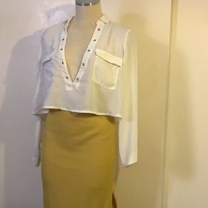 A yellow skirt and white shirt